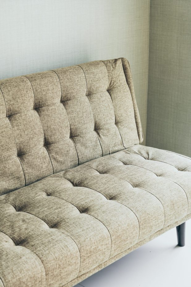 Modern fabric sofa in room interior